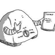 A rounded trapezoid robot on tracks holding a manuscript in one hand and rubbing its chin thoughtfully with the other. A dial on its front has five settings: FLATTER, GENTLE, FAIR, TOUGH and BRUTAL.