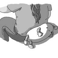 A happy, sausage-shaped robot with banded arms and legs and an antenna, lying on its side while a person sits resting their lower back against it.