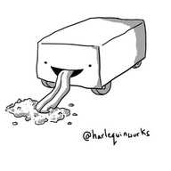 A cuboid robot on four wheels tucked under its sides. Its face is on one of its short ends and a long tongue is extending from its mouth to lap at a pile of sawdust on the floor.