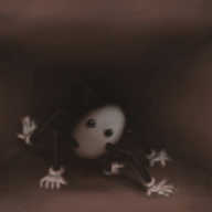An image of a corridor extending away from the frame, fading into shadow. Partway along is an ovoid robot with six jointed limbs, arrayed more or less at random about its body, each ending in a hand. The robot is slightly tilted, has no mouth, and is moving along on its limbs, pawing at the ground and walls. The whole scene is coloured in sepia tones.