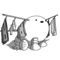 An ovoid robot with four banded legs and a luxuriant, equine tail. It;s sitting on the ground and has a drying rack affixed to each of its upper flanks, rather like wings. Each is just two poles with several struts between them, and folded clothes hang from each strut. The robot is smiling happily.