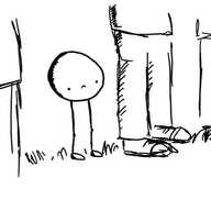 A spherical robot on two long, thin, jointed legs and with no arms standing on some grass in a row of people. It has a glum expression on its face.